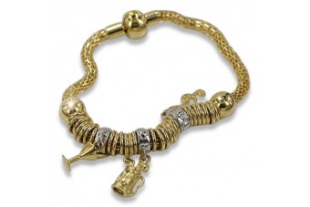 Pulsera italiana con dijes de oro amarillo de 14k cb110y