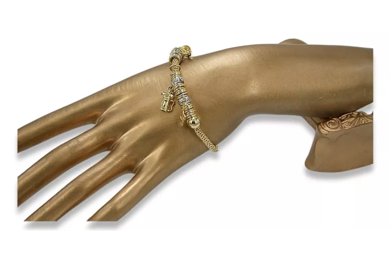 Pulsera italiana con dijes de oro amarillo de 14k cb110y