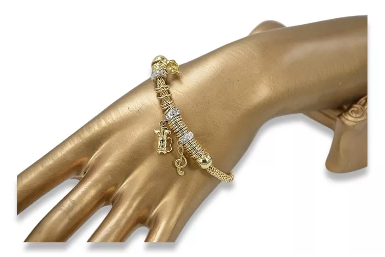 Pulsera italiana con dijes de oro amarillo de 14k cb110y